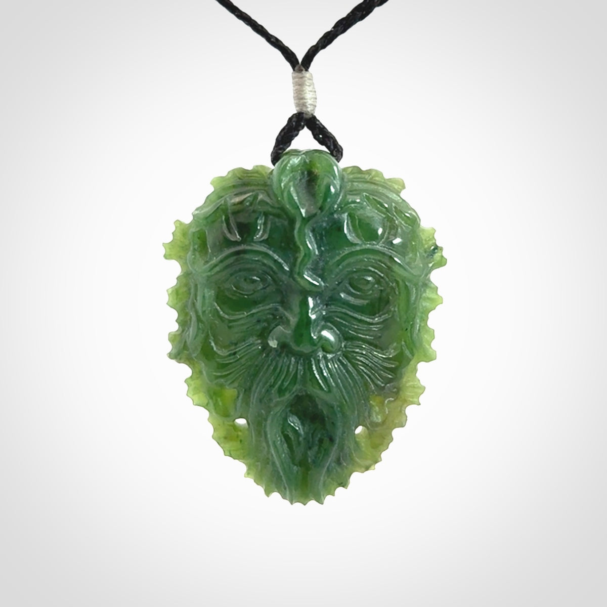 This picture shows a large hand carved forest man face pendant. The cord is hand plaited and adjustable.