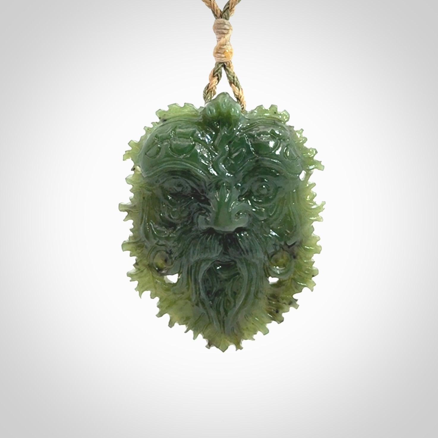 This picture shows a large hand carved forest man face pendant. The cord is hand plaited and adjustable.