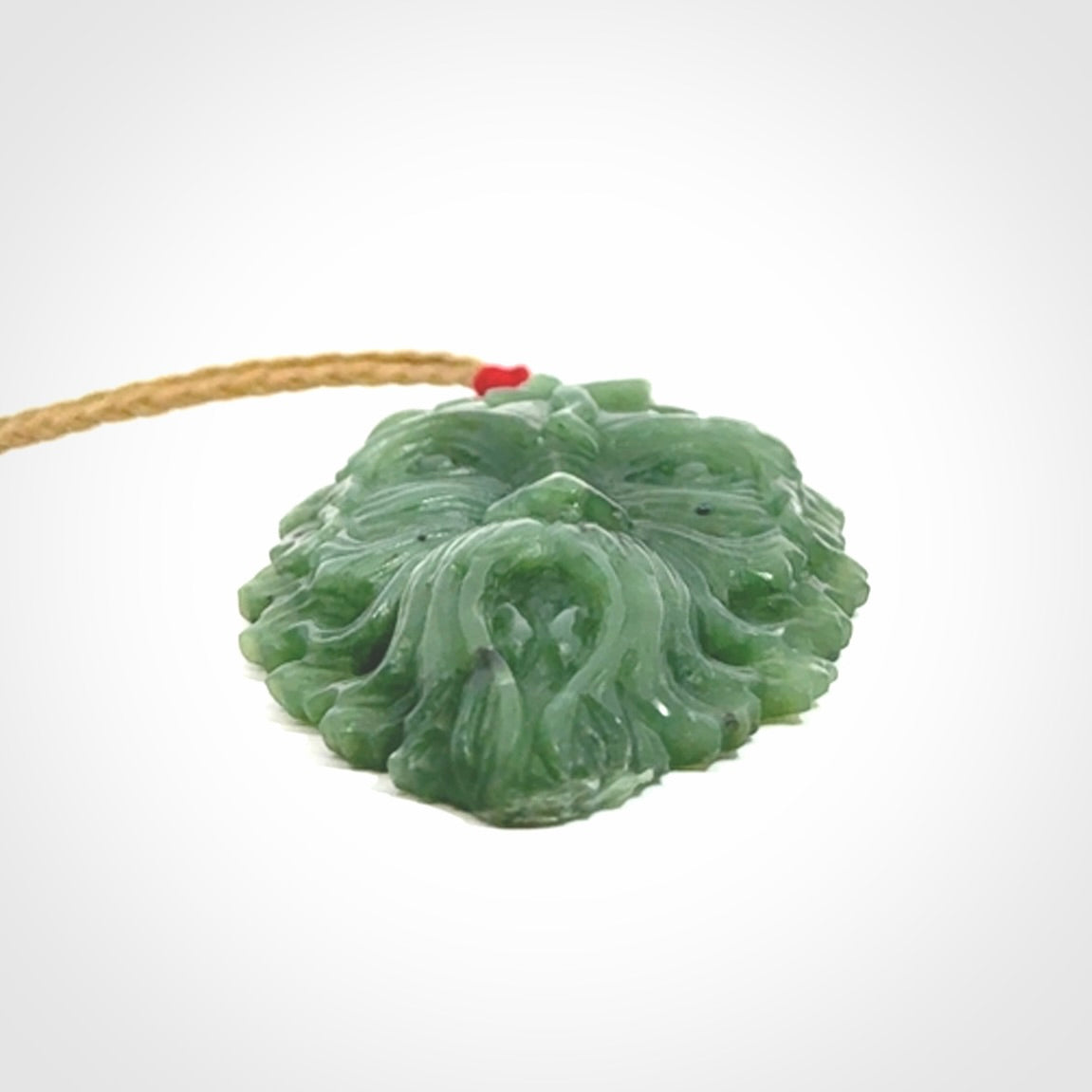 This picture shows a large hand carved forest man face pendant. The cord is hand plaited and adjustable.