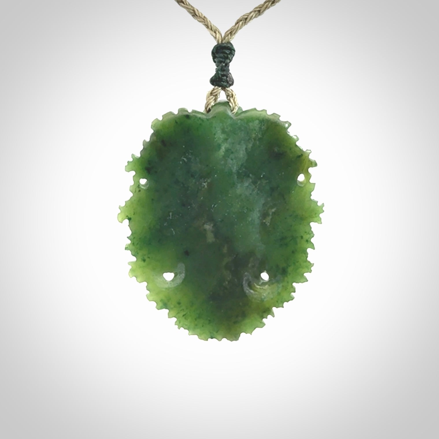 This picture shows a large hand carved forest man face pendant. The cord is hand plaited and adjustable.