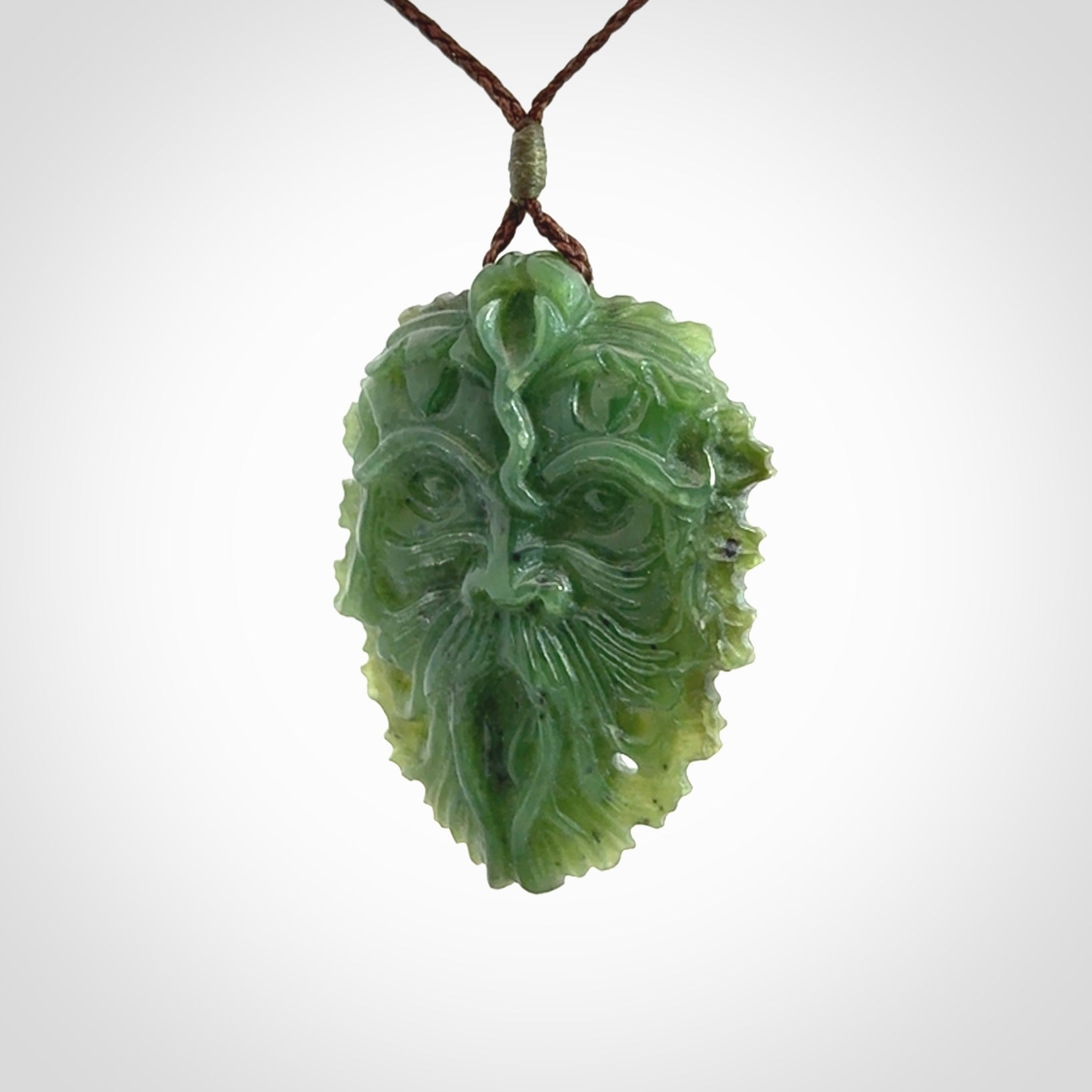 This picture shows a large hand carved forest man face pendant. The cord is hand plaited and adjustable.