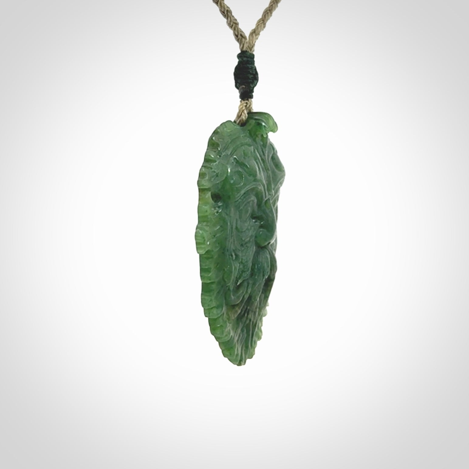 This picture shows a large hand carved forest man face pendant. The cord is hand plaited and adjustable.