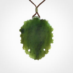This picture shows a large hand carved forest man face pendant. The cord is hand plaited and adjustable.