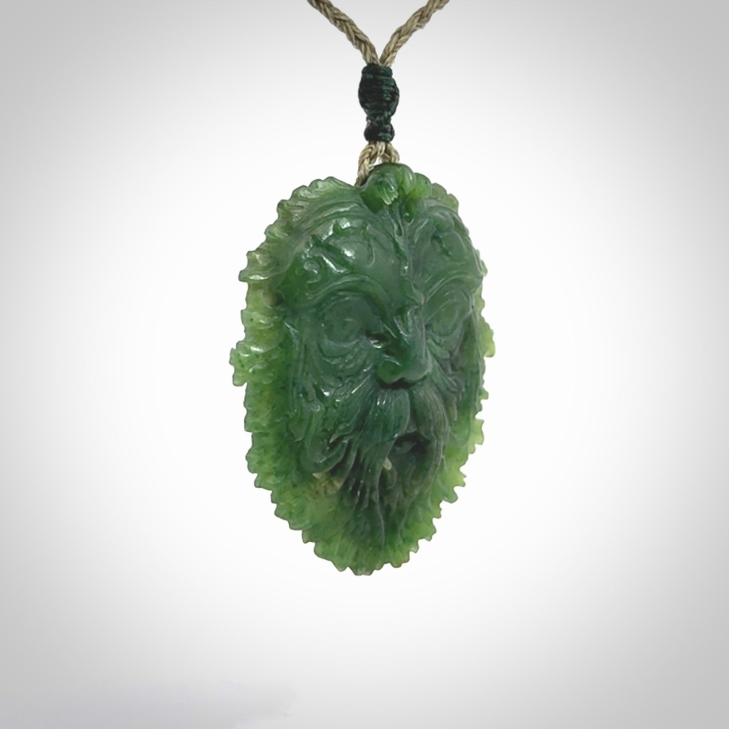This picture shows a large hand carved forest man face pendant. The cord is hand plaited and adjustable.