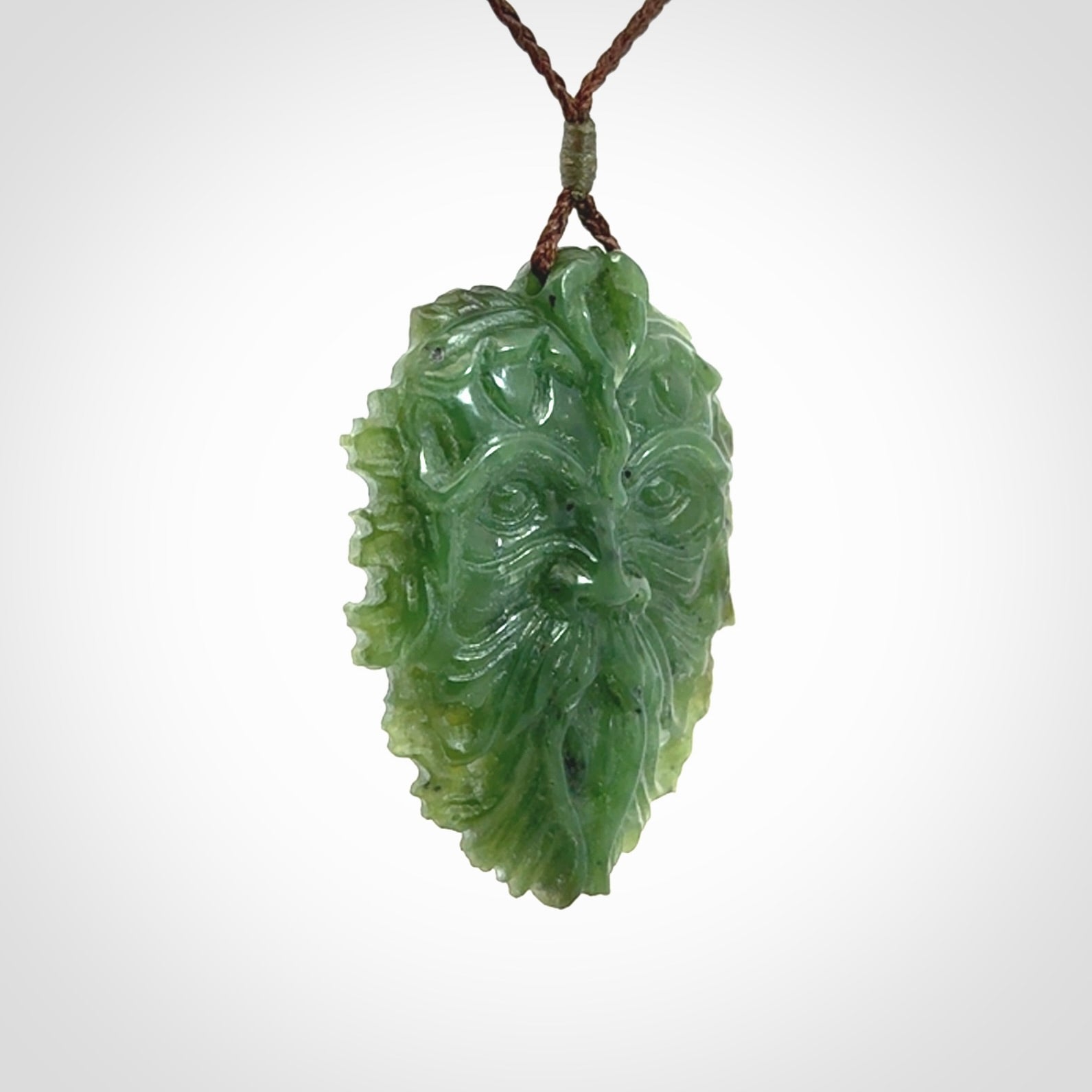 This picture shows a large hand carved forest man face pendant. The cord is hand plaited and adjustable.