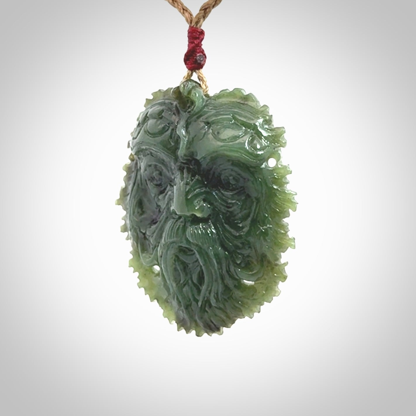 This picture shows a large hand carved forest man face pendant. The cord is hand plaited and adjustable.