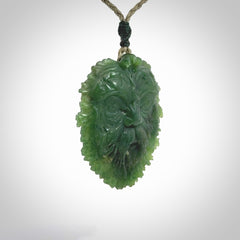 This picture shows a large hand carved forest man face pendant. The cord is hand plaited and adjustable.