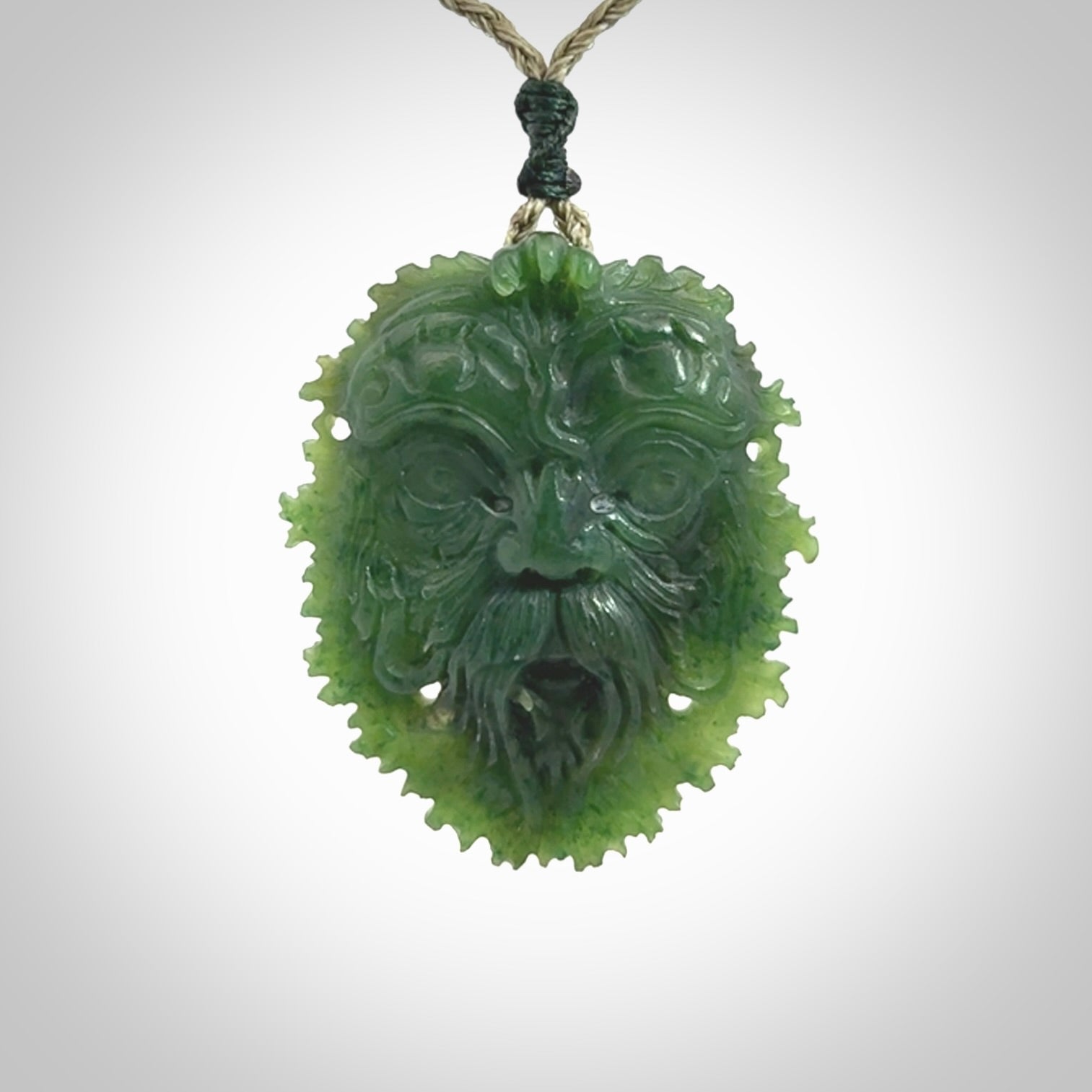 This picture shows a large hand carved forest man face pendant. The cord is hand plaited and adjustable.