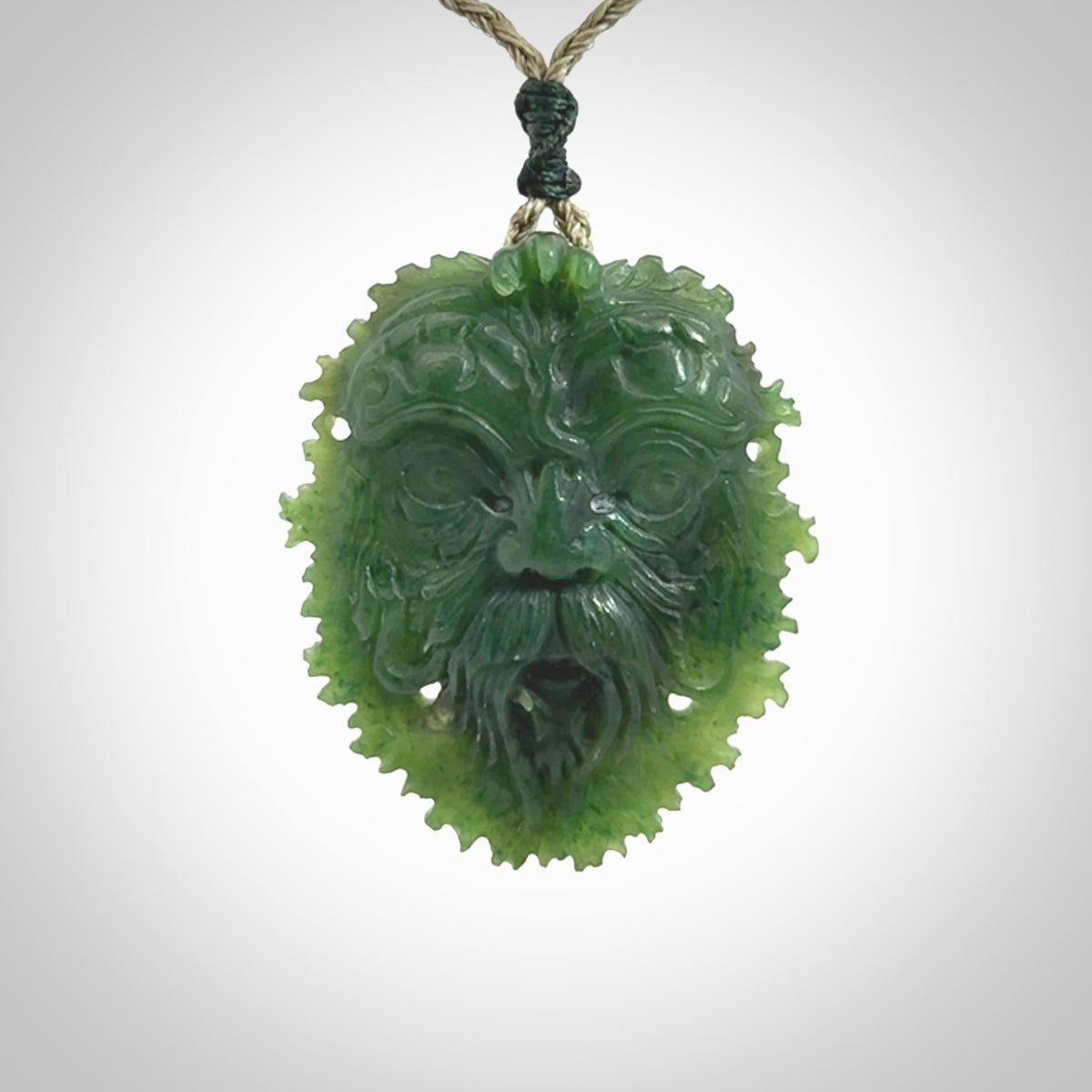 This picture shows a large hand carved forest man face pendant. The cord is hand plaited and adjustable.