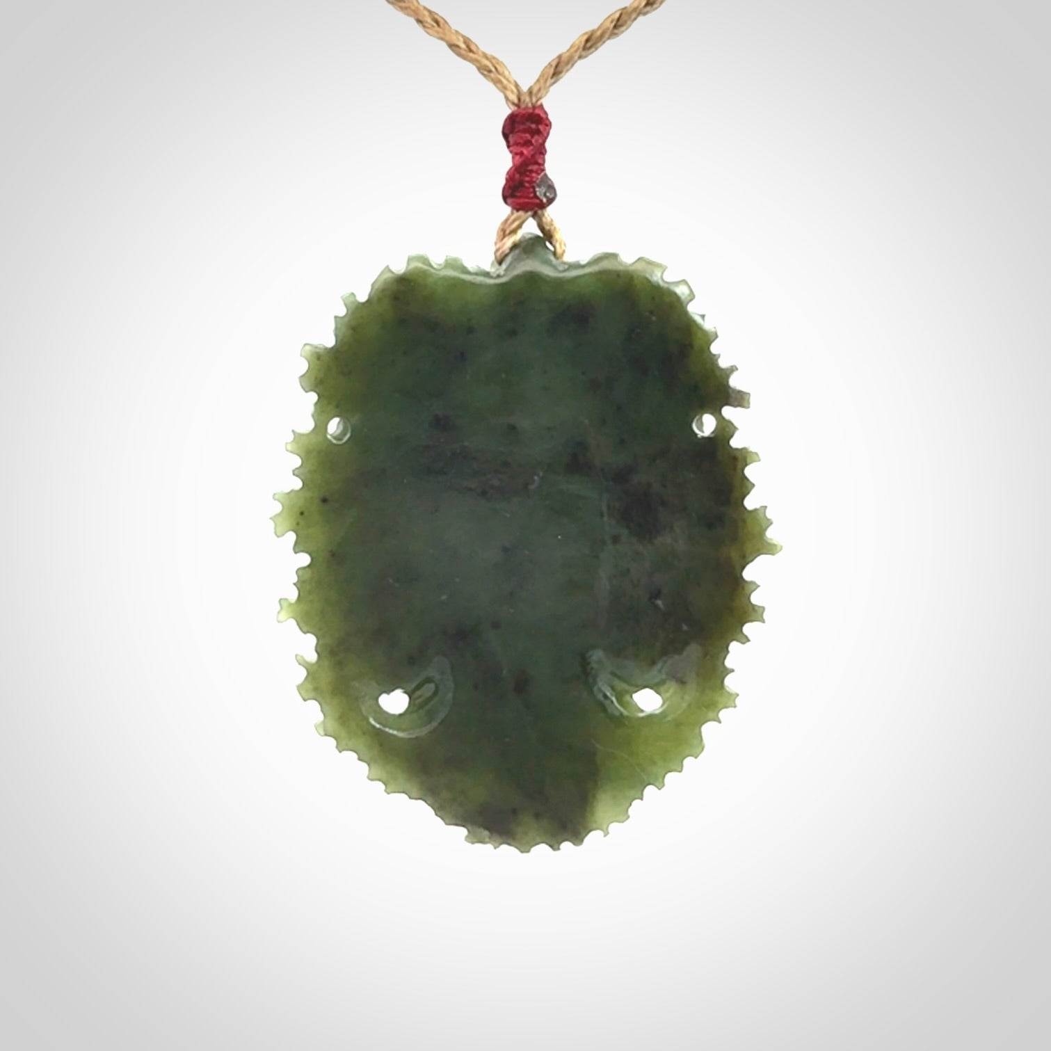 This picture shows a large hand carved forest man face pendant. The cord is hand plaited and adjustable.