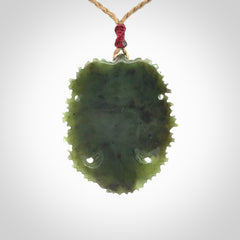 This picture shows a large hand carved forest man face pendant. The cord is hand plaited and adjustable.