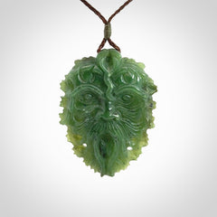 This picture shows a large hand carved forest man face pendant. The cord is hand plaited and adjustable.
