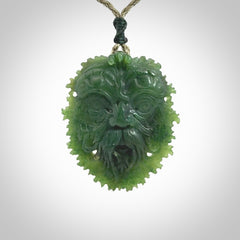 This picture shows a large hand carved forest man face pendant. The cord is hand plaited and adjustable.
