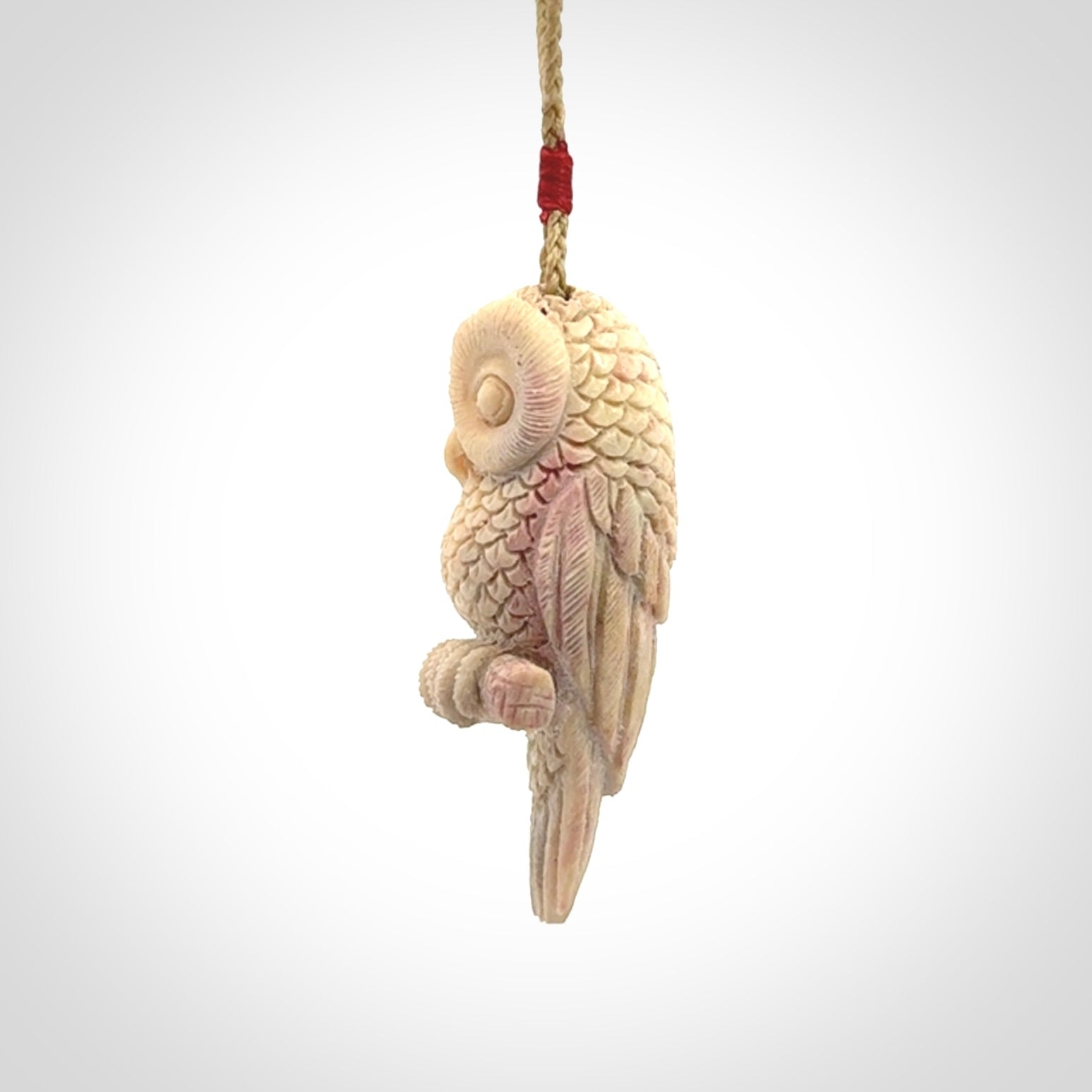 A traditional Owl design carving, hand made for us from deer antler, bone. This is a work of art and is a collectable piece of traditional bone carving. It can be worn as a special piece of jewellery or displayed. This is art made to wear at its finest.