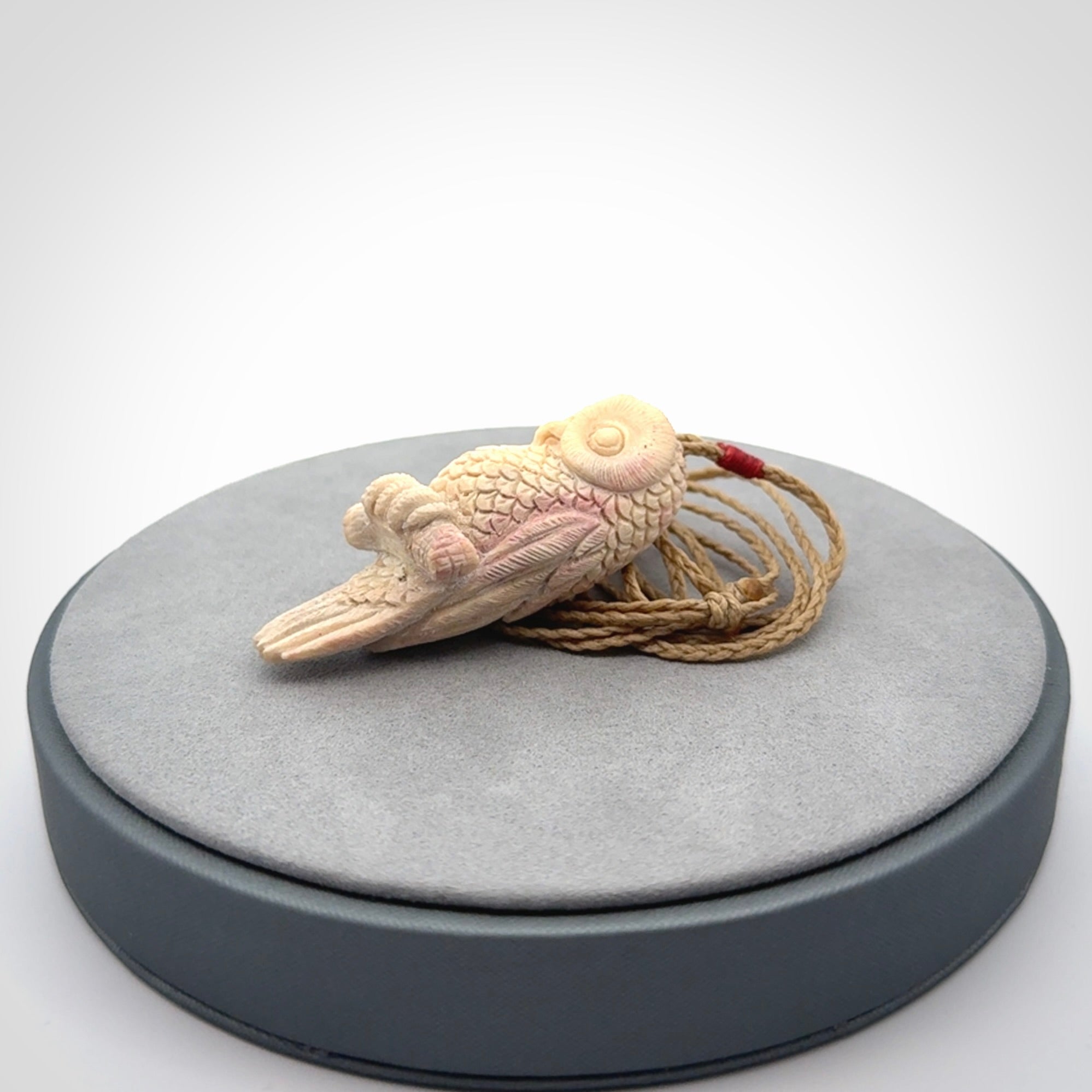 A traditional Owl design carving, hand made for us from deer antler, bone. This is a work of art and is a collectable piece of traditional bone carving. It can be worn as a special piece of jewellery or displayed. This is art made to wear at its finest.