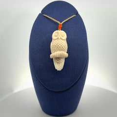 A traditional Owl design carving, hand made for us from deer antler, bone. This is a work of art and is a collectable piece of traditional bone carving. It can be worn as a special piece of jewellery or displayed. This is art made to wear at its finest.