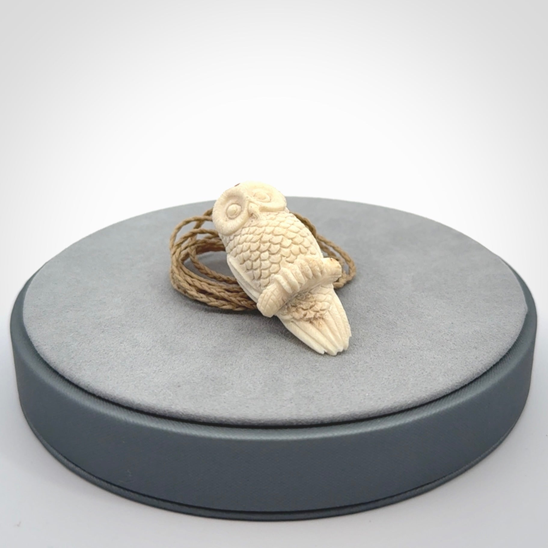 A traditional Owl design carving, hand made for us from deer antler, bone. This is a work of art and is a collectable piece of traditional bone carving. It can be worn as a special piece of jewellery or displayed. This is art made to wear at its finest.