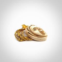 Hand carved incredible stained bone gargoyle face carving. A stunning work of art. This pendant was hand carved in bone with buffalo horn inlay for the eyes by Yuri Terenyi. A one off collectors item that has been hand crafted to be worn or displayed.