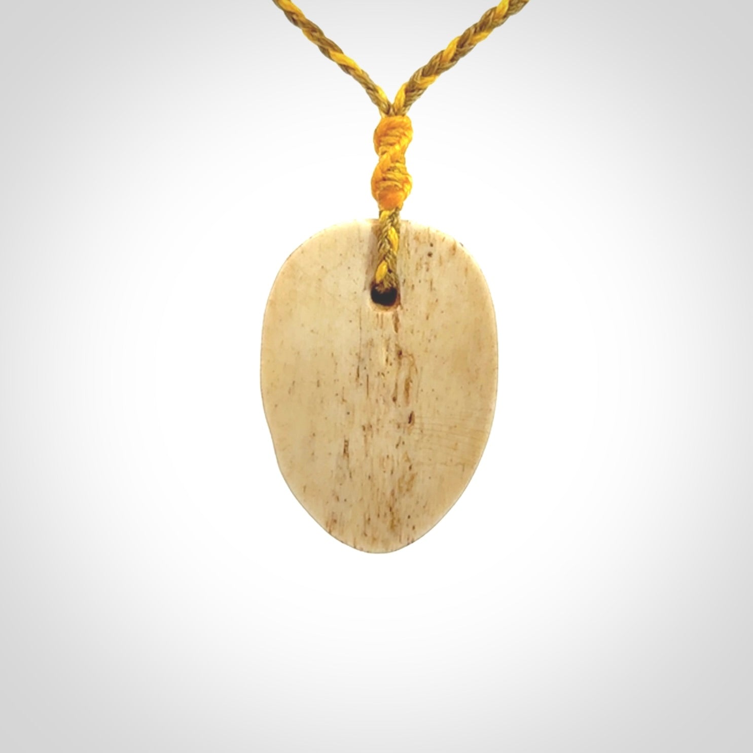 Hand carved incredible stained bone gargoyle face carving. A stunning work of art. This pendant was hand carved in bone with buffalo horn inlay for the eyes by Yuri Terenyi. A one off collectors item that has been hand crafted to be worn or displayed.