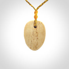 Hand carved incredible stained bone gargoyle face carving. A stunning work of art. This pendant was hand carved in bone with buffalo horn inlay for the eyes by Yuri Terenyi. A one off collectors item that has been hand crafted to be worn or displayed.
