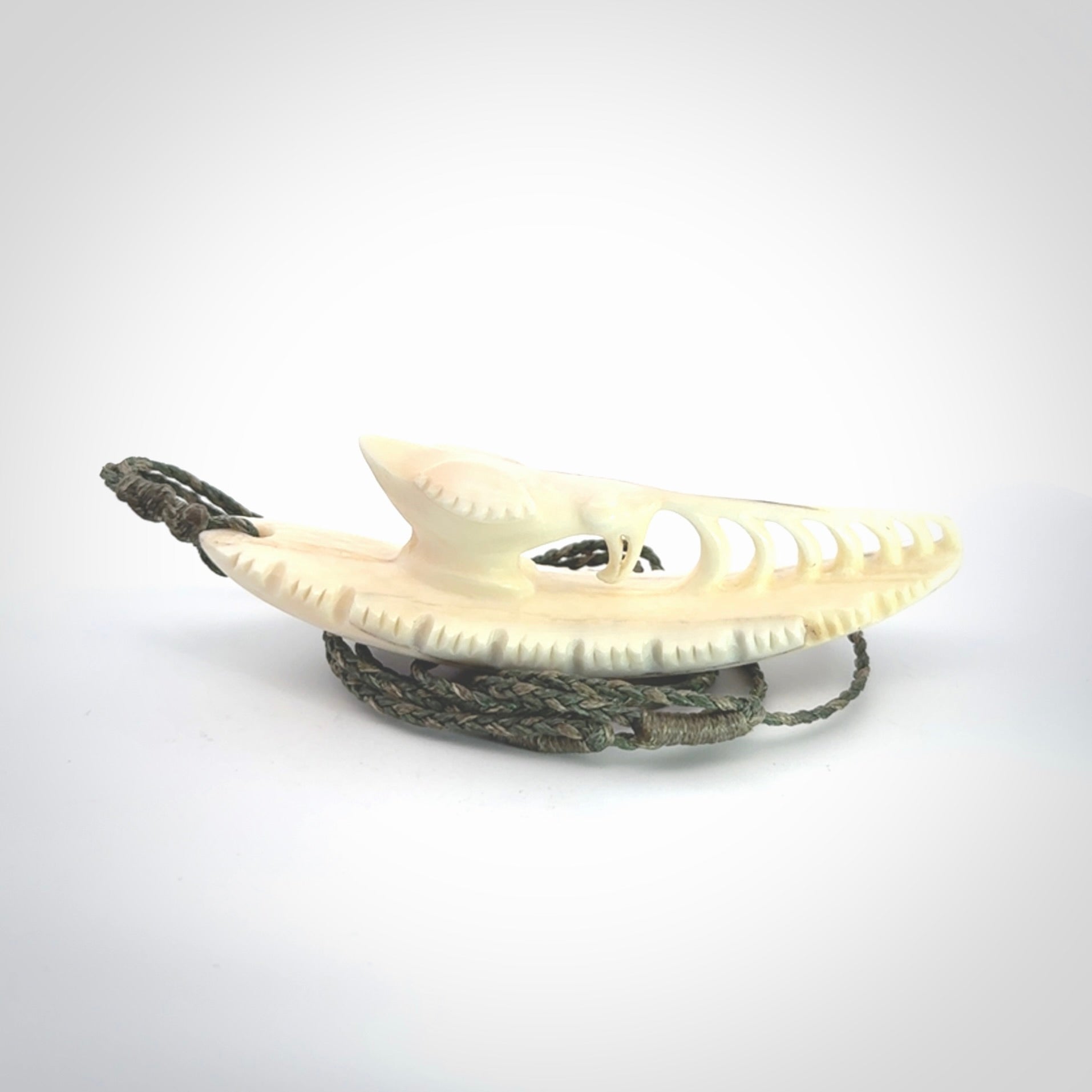 This is a hand carved bone contemporary warthog tusk pendant. Yuri Terenyi has carved this from warthog tusk. It is a delightful, large and artistic piece of jewellery. One only necklace.