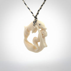 This pendant is a gorgeous and intricately carved mermaid with dolphin pendant. Carved by renowned bone carver Yuri Terenyi for us. This is a little masterpiece. It is a mermaid with her arms clasped around a dolphin. The craftsmanship displayed in this piece is extraordinary - a collectors item, or a piece to wear and love.