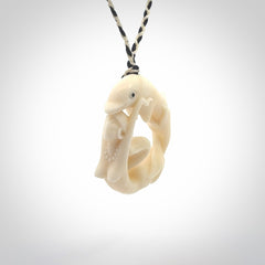 This pendant is a gorgeous and intricately carved mermaid with dolphin pendant. Carved by renowned bone carver Yuri Terenyi for us. This is a little masterpiece. It is a mermaid with her arms clasped around a dolphin. The craftsmanship displayed in this piece is extraordinary - a collectors item, or a piece to wear and love.