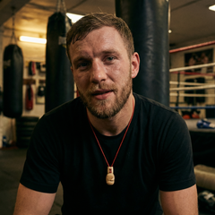 man wearing a boxing glove pendant