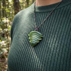 person wearing jade pendant