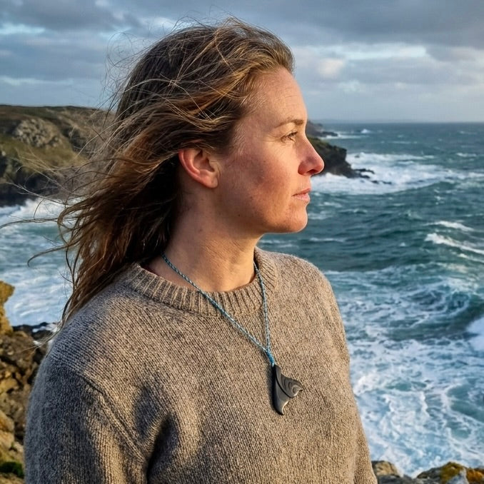 Woman wearing whale tail pendant