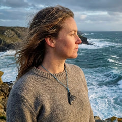Woman wearing whale tail pendant