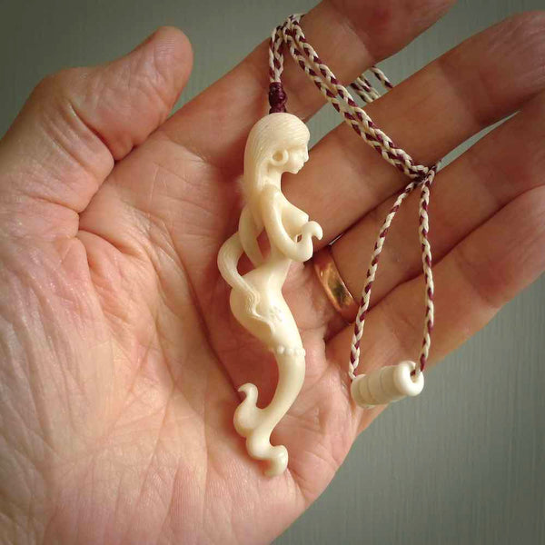 This pendant is a gorgeous and intricately carved mermaid and merman pendant. Carved by renowned bone carver Yuri Terenyi for us, this is a little masterpiece. The craftsmanship displayed in this piece is extraordinary - a collectors item, or a piece to wear and love.