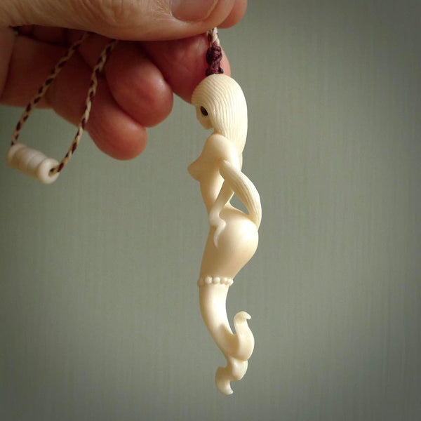 This pendant is a gorgeous and intricately carved mermaid and merman pendant. Carved by renowned bone carver Yuri Terenyi for us, this is a little masterpiece. The craftsmanship displayed in this piece is extraordinary - a collectors item, or a piece to wear and love.