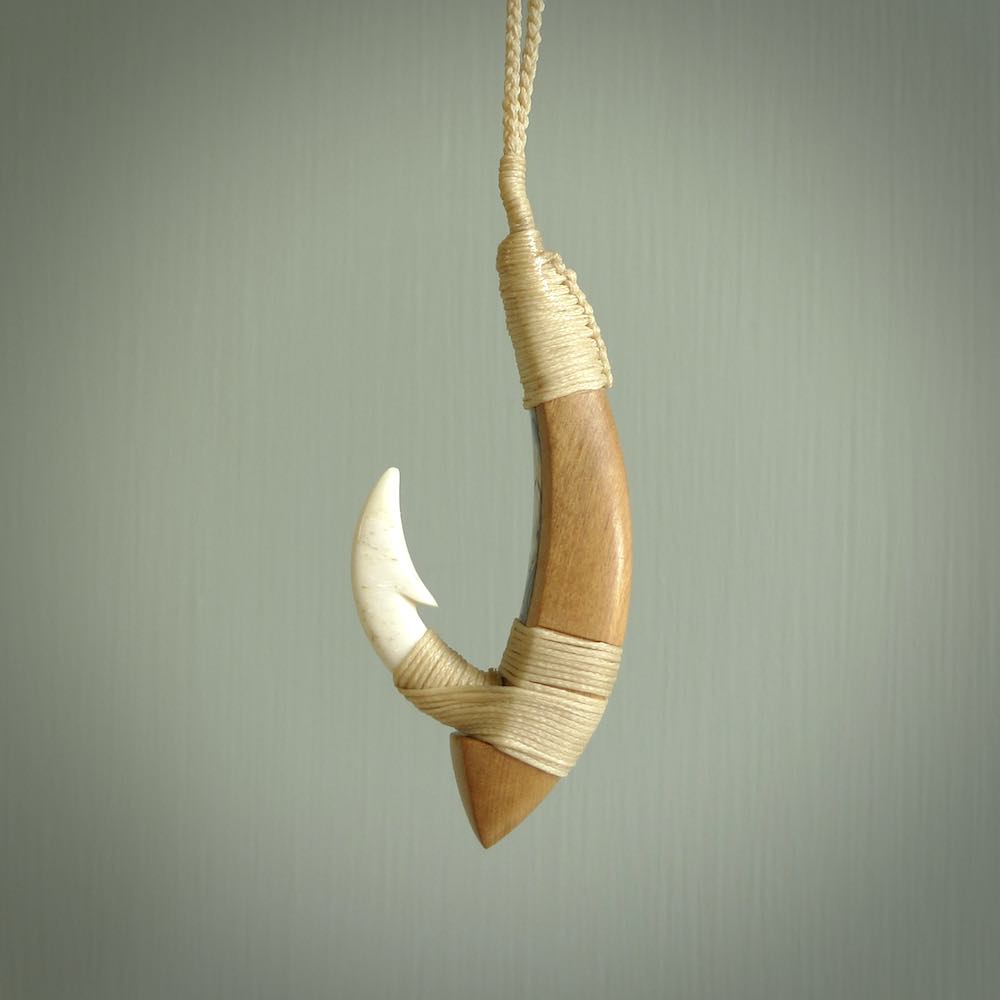 HAND CARVED BONE, WOOD, PAUA PĀ KAHAWAI. BONE PAUA MATAU PĀ