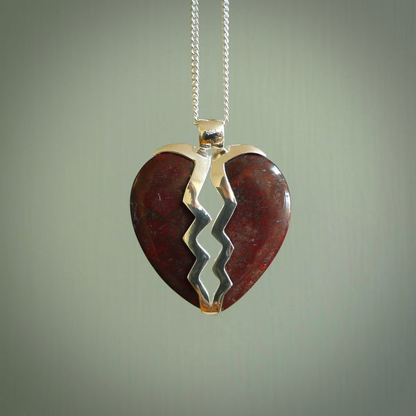 This is a handcarved love heart pendant made from a gorgeous and striking piece of red jasper stone with sterling silver. This is a superbly carved and very unique piece if custom jewellery. For sale online from NZ Pacific.