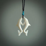 Hand carved natural double dolphin bone pendant. Hand made bone dolphin necklace, delivered with Express Courier. Hand crafted bone double dolphin pendant. One only necklace.