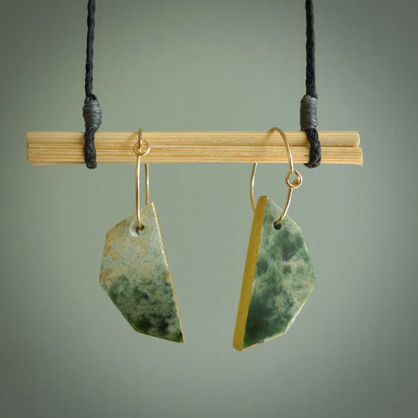 These earrings are beautifully hand made with gorgeous flair. They are fashionable and perfect for a women with style. Hand carved from a gorgeous piece of New Zealand Marsden jade with Gold leaf and gold plated hoops - they are elegant and beautiful.