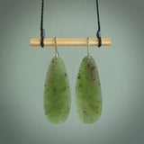 These are stunning large drop shaped jade earrings carved in New Zealand by Darren Hill. It is carved from a semi-translucent light green piece of New Zealand Jade and with Sterling Silver hooks.