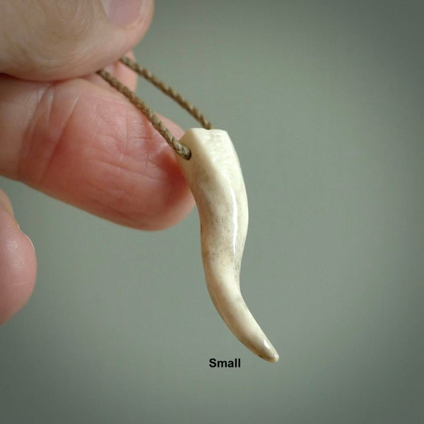 Deer Antler Bone Italian Horn pendant. Handmade bone jewellery made by NZ Pacific and for sale online. Deer Antler  Goat Horn pendant worn for protection over evil eye, bad luck and promotes fertility. Ancient symbolic necklace hand made in Deer Antler, Bone.