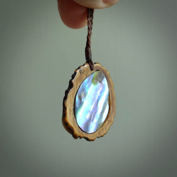 Hand carved deer antler Paua Shell Pendant. Made from Red Deer antler in New Zealand. Unique Pāua Shell necklace hand made from deer antler by master bone carver Fumio Noguchi. Spectacular collectable work of art, made to wear. One only pendant, delivered to you at no extra cost with express courier.