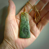 Hand made large New Zealand jade toki with koru pendant. Hand carved in New Zealand by Kerry Thompson. Hand made jewellery. Unique large Jade Toki with adjustable cord. Free shipping worldwide.