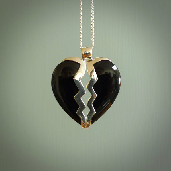 This is a handcarved love heart pendant made from a gorgeous and striking piece of Black Jade with sterling silver. This is a superbly carved and very unique piece if custom jewellery. For sale online from NZ Pacific.