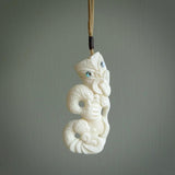 Hand carved tiki. Tiki Pendant made from cow bone by NZ Pacific. Ethnic handcarved jewellery for sale online.