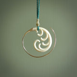 Hand carved pendants made from bone with sterling silver. NZ Pacific contemporary Koru pendants for sale online.