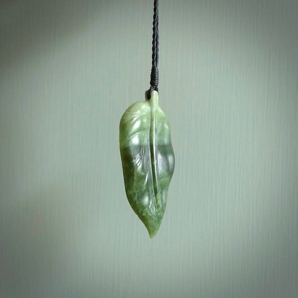 Hand carved New Zealand Jade leaf pendant with adjustable cord. This piece is a stand out work of creativity and skill and we love Raegan Bregmen's creations. Unique, one only, New Zealand made necklace for sale. Free shipping worldwide.