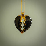 This is a handcarved love heart pendant made from a gorgeous and striking piece of Black Jade with gold plated silver. This is a superbly carved and very unique piece if custom jewellery. For sale online from NZ Pacific.