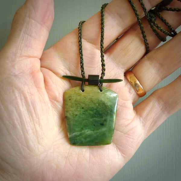 Hand carved New Zealand Jade pendant with adjustable cord. This piece is a stand out work of creativity and skill and we love Jen Hung's creations. Unique, one only, New Zealand made necklace for sale. Free shipping worldwide.