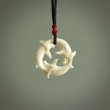 Hand carved natural bone whale trilogy pendant. Art to wear. Ocean themed pendants.