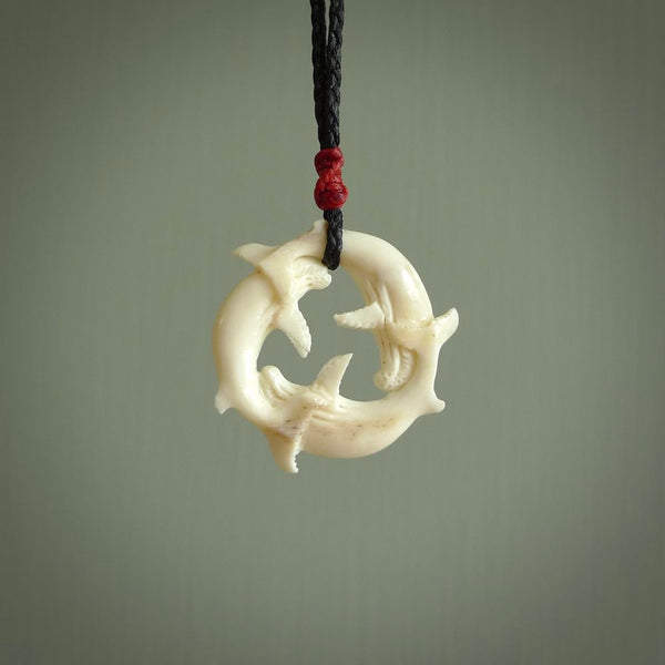 Hand carved natural bone whale trilogy pendant. Art to wear. Ocean themed pendants.
