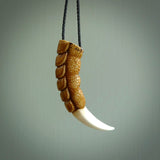 Hand carved incredible dragon claw Bone carving. A stunning work of art, beautifully replicating a dragon claw. This pendant was hand carved in bone by Fumio Noguchi. A one off collectors item that has been hand crafted to be worn or displayed.
